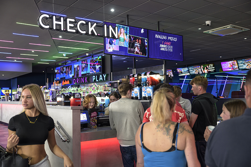 Check-in screens at venue entrance
